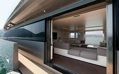 the inside of a house boat looking out at the water