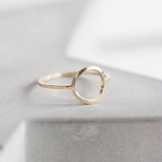 This circle ring represents the best traditions of minimalist jewelry - it is absolutely simple, but this simplicity is really beautiful. It looks gorgeous worn alone or in addition to other pieces. Wear it as a midi ring and as a regular ring - it will look awesome anyway.The ring is 1 mm thick and is very sturdy although it looks very dainty on the finger. The circle is approx. 10 mm diameter, so consider that it could look different on your ring size.You may order the ring of any size. If you Karma Ring, Simple Ring Design, Gold Circle Ring, Midi Ring, Circle Ring, Midi Rings, Modern Ring, Minimal Modern, Full Circle