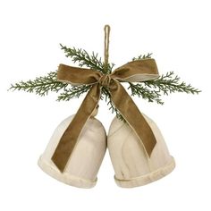 two white mittens hanging from a green ribbon on top of a wooden tree ornament