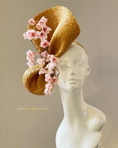 Asymmetrical mustard gold/yellow fascinator, perfect for the holidays, race day, or wedding.   Pretty cascading pink cherry blossoms. Appropriate for Easter, Royal Ascot, bridal, Kentucky Derby, Kentucky Oaks, Del Mar Races, hat contests, Central Park Hat Luncheon, church, galas, Melbourne Cup, high tea, weddings, cocktail parties, and more. Please contact us if you need assistance ordering. Complimentary domestic shipping. Yellow Fascinator, Gold Fascinator, Kentucky Oaks, Kentucky Derby Fascinator, Royal Ascot Hats, Derby Fascinator, Golden Rod, Holiday Hats, Pink Cherry Blossom