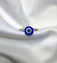 This is a evil eye ring that does not tarnish!  Remember to select your exact ring size  *Great for birthday gifts, Wedding Gifts, and Xmas gifts to Loved Ones! (Everything Nickel Free) If you have any questions feel free to message me I ship orders the next day so you get your package faster! Each order will be shipped with good care and protection, making sure your order gets to you in perfect condition I always throw in free gifts for customers when you order from me :) Symbolic Handmade Midi Rings Gift, Symbolic Nickel-free Midi Rings Gift, Evil Eye Ring Jewelry Gift, Spiritual Evil Eye Rings As Gift, Blue Stackable Midi Rings As A Gift, Blue Stackable Midi Rings For Gift, Evil Eye Open Ring As Gift, Sterling Silver Evil Eye Ring As Gift, Sterling Silver Evil Eye Ring For Gift