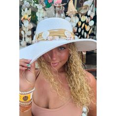 Introducing the Shell Trim Wide Brim Sun Hat - perfect for any sunny day! This fashionable hat not only provides protection from the sun's rays, but also adds a stylish touch to any outfit. With its wide brim and unique shell trim, you'll be ready for any summer adventure! * Circumference: 22 3/8" * Brim Size 3 7/8" * Crown: 3 3/4" * 80% paper, 20% polyester * UVA/UVB SPF 50 Protection Wide Brim Sun Hat For Poolside, Beachy Brimmed Sun Hat For Poolside, Wide Brim Sun Hat For Poolside Summer, Summer Wide Brim Sun Hat For Poolside, Poolside Wide Brim Sun Hat For Summer, Adjustable Boater Hat For Poolside And Beach Season, Brimmed Sun Hat For Beachwear, Beachy Sun Hat With Curved Brim For Poolside, Curved Brim Sun Hat For Poolside Beach Season