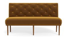 a brown couch sitting on top of a wooden frame