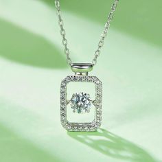 An eye-catching round moissanite dances with ease at the center of this appealing women's necklace, expressing your unstoppable love. Additional round gem set in sterling silver frame the center. Features Moissanite was originally found in meteorites(Chemical name: Silicon Carbide). It was first discovered in 1893, while a scientist was examining meteor samples from a crater in Arizona. After many years, the experts has been recreated moissanite in the laboratory, that make the gemstone with fri Cubic Zirconia Necklace With Center Stone For Gift, Silver Round Necklace With Center Stone, Sterling Silver Necklace With Center Stone, Silver Lab Grown Diamond Solitaire Necklace, Silver Solitaire Necklace With Diamond Accents In Moissanite, Silver Sterling Solitaire Necklace With Halo Design, Silver Solitaire Necklace With Halo Design In Sterling Silver, Dazzling Necklace With Center Stone For Gift, Dazzling Necklace With Center Stone As Gift