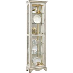 a white china cabinet with glass doors and plates