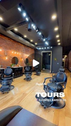 a hair salon with lots of black chairs and lights on the ceiling is featured in this video