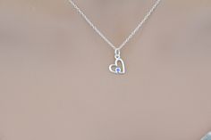 This is a beautiful Sterling Silver Birthstone Heart March Aquamarine Crystal Necklace. Both the charm and the chain are made from sterling silver. :) Measurement of charm in mm: Height: 14 Width: 9 Thickness: 1 (height includes jump ring) Measurement of necklace length in Inches: You will be able to select a 16, 18, or 20 inch chain. There are two types of chains, the regular chain or an upgraded chain option. Check out the last two pictures to see which chain you like best. Add a Swarovski Bir Silver Birthstone Necklace With Heart Charm, Silver Birthstone Heart Pendant Charm Necklace, Silver Heart Pendant Birthstone Charm Necklace, Sterling Silver Heart Charm Birthstone Necklace, Sterling Silver Birthstone Necklace With Heart Charm And Pendant, Sterling Silver Birthstone Necklace With Heart Pendant And Charm, Sterling Silver Heart Birthstone Necklace, Silver Birthstone Pendant Necklace With Heart Charm, Sterling Silver Heart-shaped Birthstone Necklace