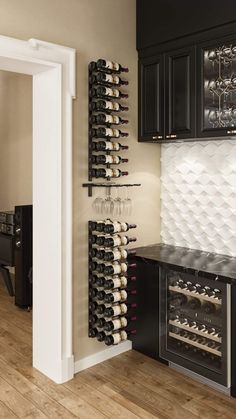 a wine rack in the corner of a kitchen next to a wall mounted wine glass holder