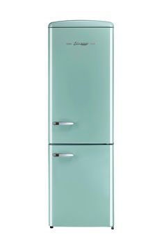 a mint green refrigerator freezer sitting on top of a white counter next to a wall