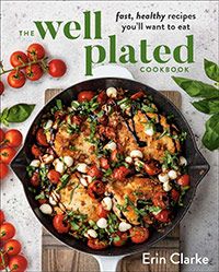 the well plated cookbook is on display with tomatoes and other vegetables in it