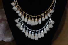 a full top set of false teeth strung on an 17 inch silver or gold plated chain with a lobster clasp. Each tooth is set in an endcap and connected to its own link in the chain so they wont jostle each other for space. These are the sort of teeth which come on a wax strip for choosing the color/ shape of denture teeth About these teeth: I get the teeth for these necklaces from a variety of sources, usually in batches. At this time I am using a mixture of vintage porcelain and acrylic/ polyresin te