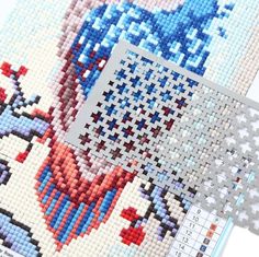 the cross stitch pattern has been made with different colors and shapes, including red white and blue