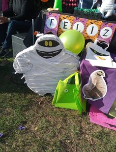 some paper bags and balloons on the ground