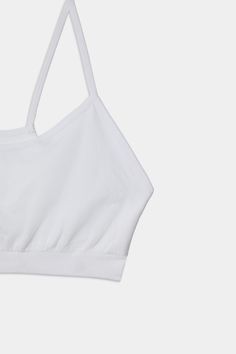 An easy to wear seamless bra designed to go from gym to everyday...seamlessly. Chafe-free fabric lets you move with easy and layers beautifully under any top. BEST FOR: running, yoga, crossfit, barre, pilates, spin class or gym workouts. Model is 5'10" and wears a size XS/S. Light Support Stretch Sports Bra, Versatile Light Support Sports Bra, Sports Tank Top With Built-in Bra And Minimal Stretch, Cotton Gym Activewear With Built-in Bra, Micro-elastic Seamless Tops With Built-in Bra, Crop Top With Built-in Bra For Light Exercise, Stretch Crop Top With Built-in Bra For Workout, Functional Crop Top With Built-in Bra For Pilates, Functional Crop Top With Built-in Bra For Workout