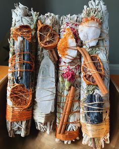 an assortment of sticks wrapped in paper on a plate