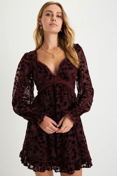 We already know your closet is full of beauties, but the Lulus Charming Favorite Burgundy Burnout Velvet Babydoll Mini Dress is definitely going to be one of your top picks! A velvet floral burnout design adorns a sheer mesh overlay (atop a matching knit liner) that shapes a lightly gathered bodice, a plunging, sweetheart-style neckline, and long sleeves with elasticized, ruffled cuffs. The high, empire waist tops a twirl-worthy skater skirt that falls to a ruffled mini hem. Delicate crochet lac Goth Princess, Empire Waist Tops, Delicate Crochet, Babydoll Mini Dress, Burnout Velvet, Lulu Fashion, Grad Dresses, Mesh Overlay, Long Sleeve Mini