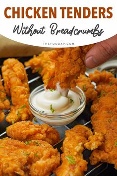 fried chicken tenders with ranch dressing in a glass bowl on top of a grill