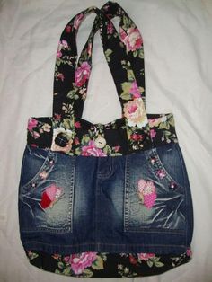 a denim purse with flowers and hearts on it