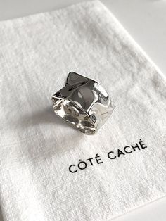 Silver Wave ring, by Côté Caché. This ring shines as though it were water, ebbing and flowing with liquid light.    ✦ Material : Sterling Silver ✦ Dimensions : T12.6mm ✦ Gift box included. ✦ Free UK Postage on orders over £49. ✦ International postage available. Reveal your hidden side, with Côté Caché. ~ Every Côté Caché piece is exclusively designed, combining symbolic aesthetics with innovative craftsmanship to create pieces that are as unique and beautiful as you are. Follow us for the latest Mens Silver Ring, Liquid Light, Chunky Silver Rings, Chunky Ring, Wave Ring, Chunky Rings, Mens Silver Rings, Jewelry Lookbook, Unique Ring