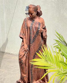 🎈This Nigerian Bubu Dress is made of high-quality adire silk (Nigerian tie-dye) that feels good on the skin. Look simple, yet sophisticated enough to steal all the attention in this gorgeous Kaftan. 🎈Details -Size: Loose fit customized to your size. This dress is made for you - 2 Side Pockets -Length 58 inches (can be adjusted to your desired length) -Neckline: Off Shoulder/ Slant Shoulder -100% West African Silk -Fabric is hand-dyed in Nigeria -Handmade in Nigeria - Soft on the skin & flowy - Bridesmaid Asoebi, Ankara Bubu Gown Styles, Ladies Party Wear, Arabian Theme, Party Wear Casual, Bubu Gown, Singer Dr, Boubou Styles For Women, Bubu Gown Styles