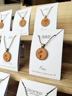 the necklaces are on display for sale at the store's opening day event