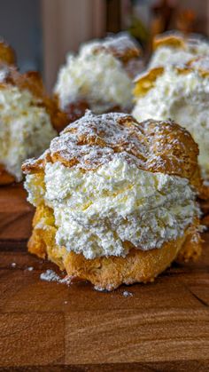 the pastry is covered with powdered sugar and sits on a cutting board, ready to be eaten