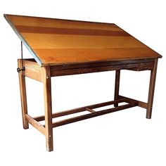 an old wooden desk with two drawers on one side and a drawer at the top