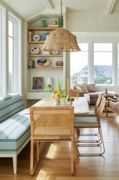 a dining room table with chairs and a bench