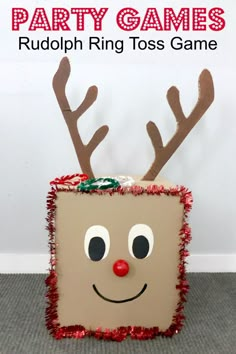 a cardboard box with reindeer antlers on it and the words party games rudolph ring toss game