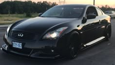 a black sports car parked on the side of the road