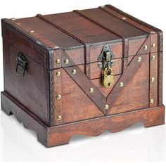 an old wooden chest with brass hardwares on the front and sides, sitting on a white surface