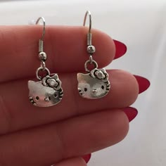 Silver Hello Kitty Earrings Hypoallergenic Hooks! These adorable Hello Kitty dangle earrings are made of Tibetan silver and are on hypoallergenic hooks that won’t hurt your ears. Signed on the back. They are brand new, handmade, and never been worn. Lead and nickel free. Rubber backs included. These fine quality earring are perfect and comfortable for all day, everyday wear or a special gift.   Send offers and questions. Hello Kitty Jewelry Earrings Hello Kitty Jewelry Earrings, Silly Earrings, Hello Kitty Earrings, Y2k Hello Kitty, Hello Kitty Jewelry, Hello Kitty Aesthetic, Earrings Hypoallergenic, Hello Kit, Cute Hello Kitty