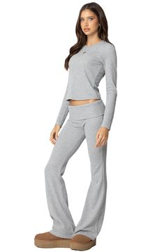 Waffle-knit fabric brings a sporty, casual look to fabulously flared pants flaunting a low-rise foldover waist. Pull-on style 43% rayon, 34% polyester, 19% nylon, 4% spandex Machine wash, dry flat Imported Foldover Pants, Fold Over Pants, Soft Outfits, Flare Sweatpants, Brandy Melville Pants, Waffle Knit Long Sleeve, Summer Wishlist, Satin Pillow, Spandex Pants