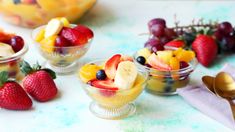 small bowls filled with fruit on top of a table