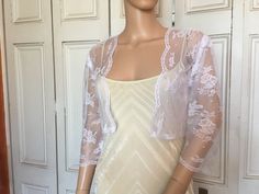 This is a beautiful hand made white lace jacket ideal for weddings or special occasions. The jacket has 3/4 length sleeves. It can also be worn with casual wear. It can be made in any size from 8 to 24 (UK sizes). It is made in the UK. It is normally sent out to you within 5 days, but I am very happy to make your order a priority if you need it urgently. Just let me know the date needed by. Postage is free in the UK! International postage is £9. I am happy to exchange items or refund your paymen Fitted Shrug With Lace Sleeves For Spring, Spring Fitted Shrug With Lace Trim, Fitted Party Shrug With Lace Trim, Fitted Lace Trim Shrug For Party, Fitted Lace Trim Party Shrug, Fitted 3/4 Sleeve Party Shrug, Fitted Lace Shrug With Lace Trim, Fitted Shrug For Summer Wedding, Fitted Summer Wedding Shrug