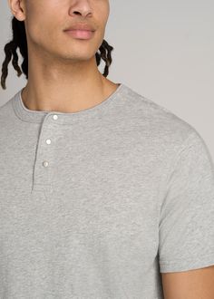 About Our Jersey Henley Tee for Tall Men The henley tee: effortless, comfortable and easy to style. An iconic wardrobe staple, it's high time there was a henley tee for tall men. This short sleeve is made with 100% jersey cotton that's incredibly soft and falls just right. Featuring our standard fit that's long enough for your torso without being baggy, it's a casual piece that goes with everything. Whether you pair it with chinos and jeans or your favorite joggers, you'll reach for this tall me Casual Henley Neckline T-shirt, Casual Cotton Crew Neck Henley, Casual Crew Neck Henley For Loungewear, Cotton T-shirt With Henley Neckline, Casual Relaxed Fit Henley For Gatherings, Classic Henley Neckline Top With Relaxed Fit, Gray Cotton Henley Neckline Top, Casual Gray Henley Neckline Top, Casual Cotton Henley For Gatherings