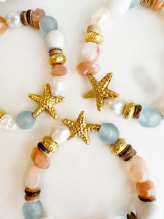 Ocean-inspired Beaded Bracelet Jewelry, Starfish-shaped Beaded Jewelry For Beach Season, Beaded Starfish Jewelry For Beach Season, Gold Spiritual Jewelry For Vacation, Bohemian Starfish Bracelet As Gift, Bohemian Strand Bracelet With Starfish Charm, Bohemian Beaded Bracelet With Starfish Charm, Bohemian Strand Beaded Bracelet With Starfish Charm, Bohemian Starfish Jewelry For Vacation