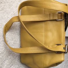 Super Soft Cute Mustard Yellow Handbag. One Outer Zip Pocket. One Inner Zip Pocket And Two Inner Reach In Pockets. 11 Inch Straps/Medium Size. Soft Leather! Everyday Gold Bags With Snap Closure, Leather Office Bags With Snap Closure, Classic Yellow Satchel With Adjustable Strap, Classic Yellow Office Bag, Yellow Leather Shoulder Bag For Office, Classic Yellow Shoulder Bag With Soft Leather, Yellow Satchel Bag With Leather Lining, Classic Yellow Soft Leather Shoulder Bag, Yellow Rectangular Soft Leather Satchel