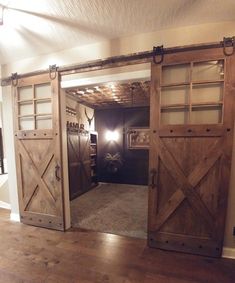 an open barn door leading into a living room