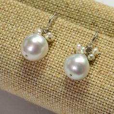 DESCRIPTION: Thank you for coming in! 14K solid white gold earrings with 11mm South Sea white baroque pearls and seed pearl accents! Full of luster and elegance! ! It looks much much nicer on your ears! You will receive the exact pair of earrings in the pictures! WEIGHT: 4.63 Grams LENGTH: 1 inch MATERIAL: 14K Solid White Gold, South Sea White Pearl, Seed Pearls Formal White Cluster Earrings With Pearl Drop, Elegant White Pearl Drop Cluster Earrings, Elegant White Cluster Earrings With Pearl Drop, Pearl White Sterling Silver Pearl Earrings, Pear-shaped Pearl Charm Earrings In White Gold, White Pearl Drop Cluster Earrings For Anniversary, White Gold Pear-shaped Earrings With Pearl Charm, Pear-shaped White Gold Earrings With Pearl Charm, White Akoya Pearl Earrings With Pearl Charm