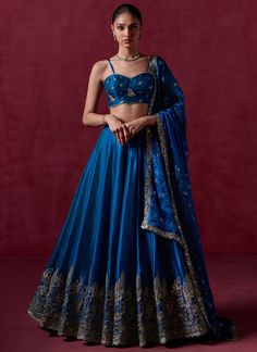 Our Peacock Blue Embroidered Organza Lehenga includes an organza top with santoon inner, organza bottom with santoon inner, and an organza dupatta. Embroidery is present on this style using sequins, thread, and zari embellishments. Like all of our pieces, this piece is made in India and checked by hand to ensure high q