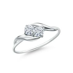 a white gold ring with a single diamond in the center and a twisted band around it