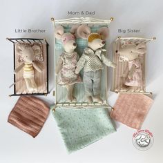 three stuffed mice are posed in an old fashioned photo frame with matching baby blankets and handkerchiefs