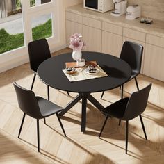 a black table with four chairs around it