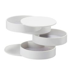 three white dishes stacked on top of each other