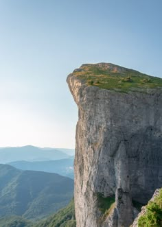 a person standing on the edge of a cliff