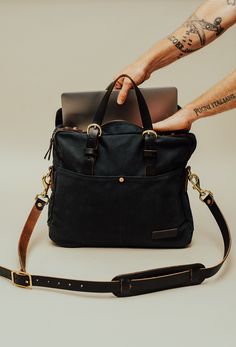 A work friendly messenger bag. Intended to organize laptop, pens, phones, and books. Constructed of American-made leather, waxed canvas, and brass. Waxed Canvas, Work Bag, American Made, Snap Button, Leather Trims, Messenger Bag, Design Features, Handles, Laptop