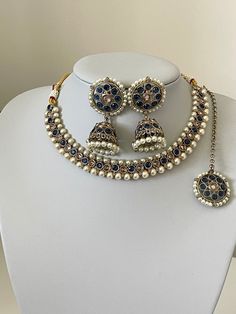 This beautiful Monalisa stoned set that comes with cute jhumka earrings and tikka.  The earrings to this set a cute size for all customers that do not want anything got big for heavy.  Please follow our Instagram page  @sakavano_jewellery for all our latest offers.  Please note we do not offer any refunds or exchanges due to hygiene reasons. Indian Choker, Blue Choker, Indian Navy, Page Instagram, Choker Set, Jhumka Earrings, Wedding Jewellery, Wedding Jewelry Sets, Indian Jewellery