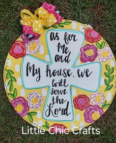 a yellow and white plate with a cross on it that says as for me and my house we serve the lord