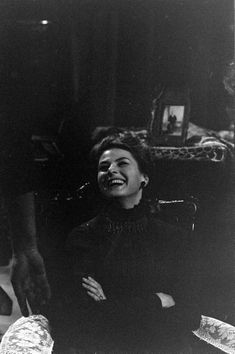 black and white photograph of a woman laughing